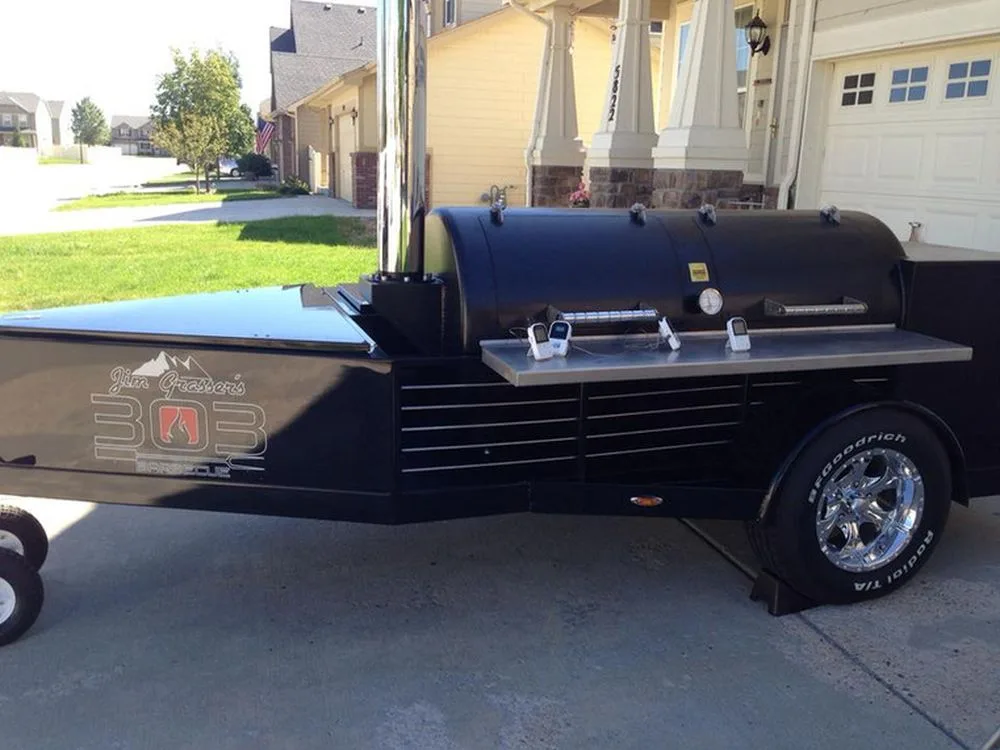 Black Jambo J3 trailer pit with team graphics, chrome wheels and stainless shelf