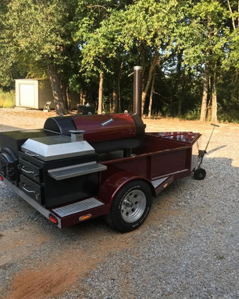 Burgundy and black Jambo J5 trailer pit with stainless warming box and drawers
