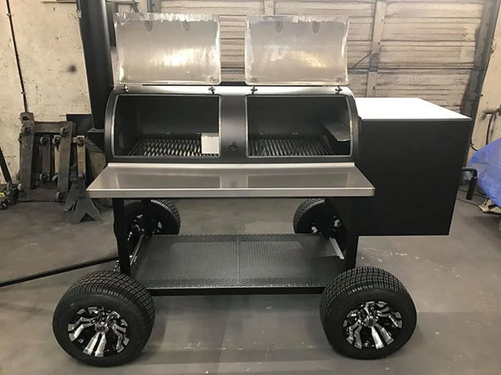 Jambo Baby J with both chamber doors open, stainless shelf and custom wheels in a shop