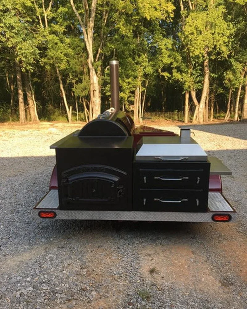 Black Jambo J5 firebox and storage drawers on a trailer