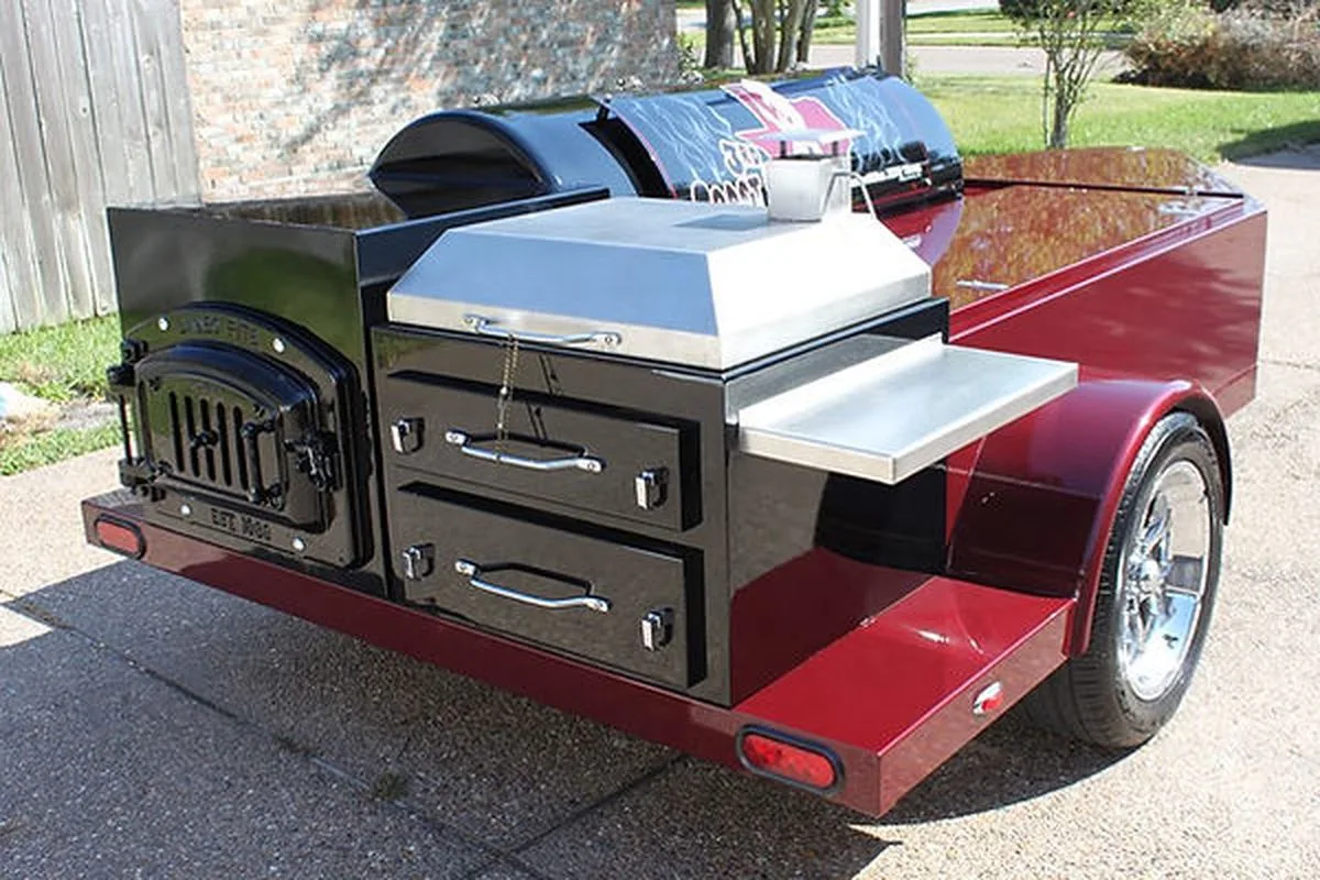 Two Jambo pits with custom red graphics inside a shop