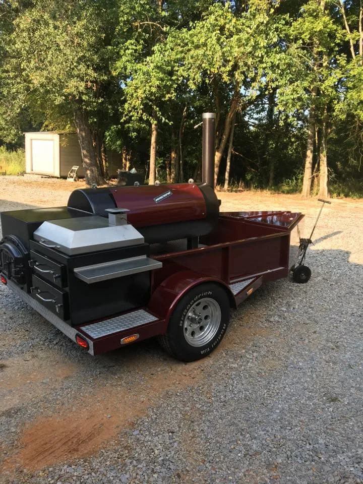 Burgundy custom Jambo trailer pit seen from the rear three-quarter