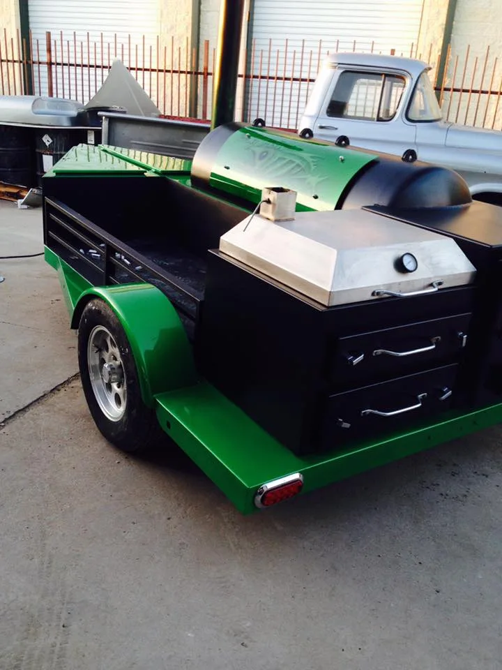 Green Jambo J5 trailer pit with black storage drawers and stainless work surfaces
